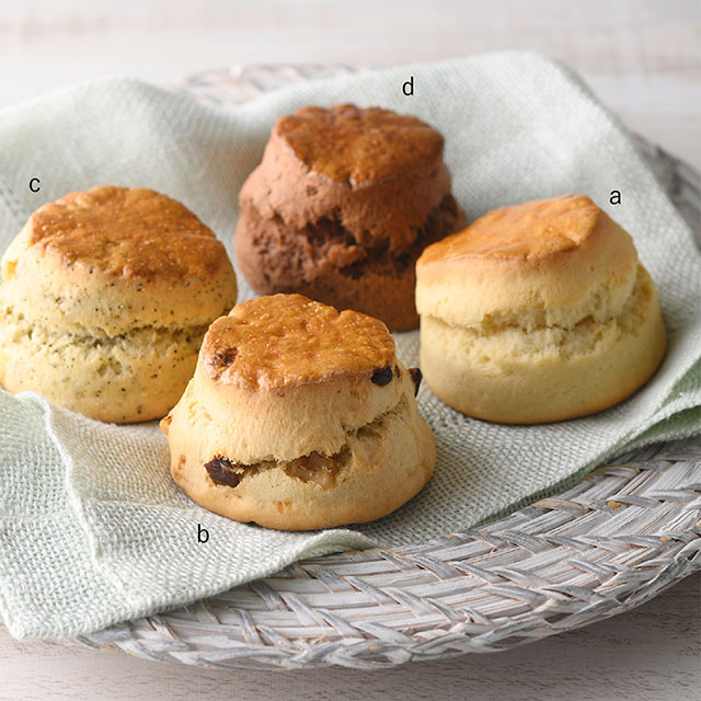 「＜ライアン・スメドレー＞コーニッシュスコーン a.プレーン　b.いちじくクルミ　c.アールグレイポピーシードレモン　d.チョコアップル」＜価格：各378円＞【魅惑の英国菓子「スコーン・ウェルシュケーキ・ファッジ」も！日本初上陸スイーツも楽しめる「英国展 日本橋三越本店 2024」開催】