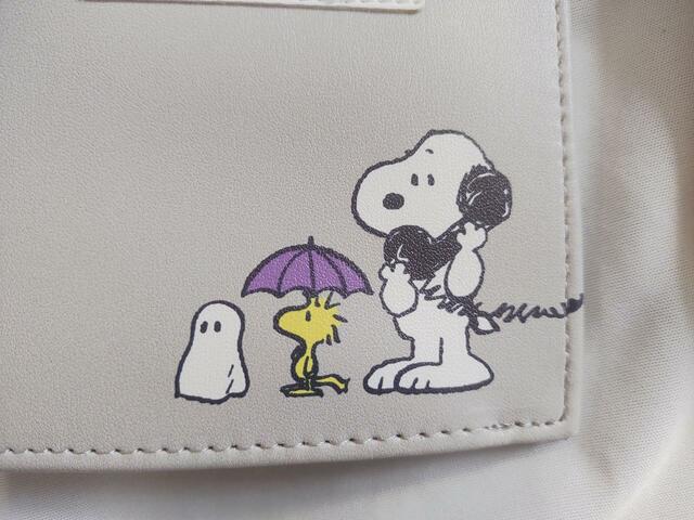 スヌーピーが受話器を持って誰かと話しているイラスト付き