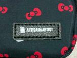 右下に「ARTISAN ARTIST」のロゴタグ付き