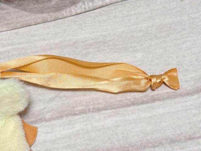 巾着の紐はサテン調のリボン仕様。それぞれのキャラクターのイメージカラーです。シーサーはオレンジ!