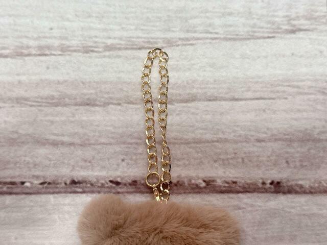 上部にゴールドのチェーン付き