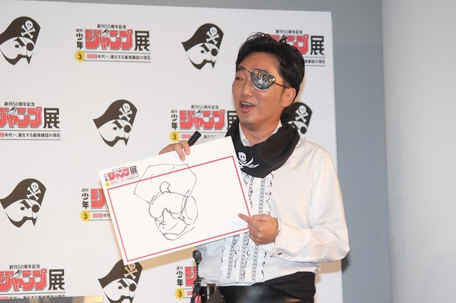 『キン肉マン』の超人・ブロッケンJr.の似顔絵を描いてみせた小沢一敬さん。他にアシュラマンの似顔絵も披露