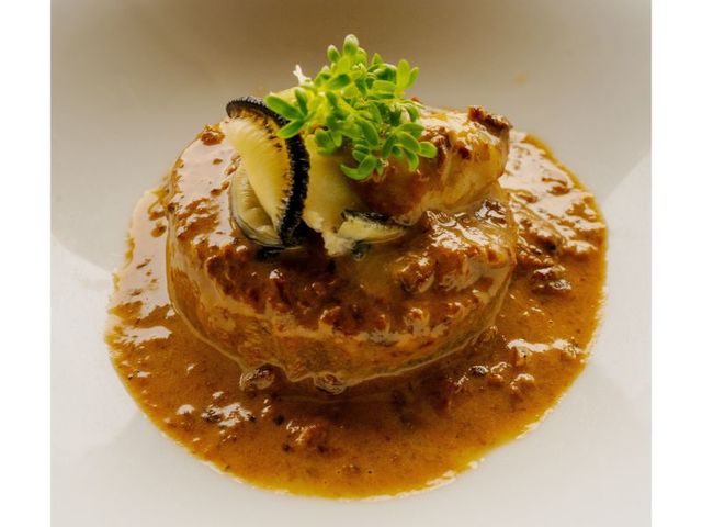 牡蠣と牡蠣出汁で炊いた大根のポルチーニクリームソース