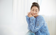 Portrait of young beautiful asian woman relax face in winter bedroom. Closeup sexy beauty fashion girl healthy makeup facial treatment perfect glow skin. Smile happy hygge asia korean girl feel cold.
