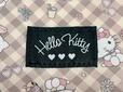 ブラックの「Hello Kitty」の織りタグ付き