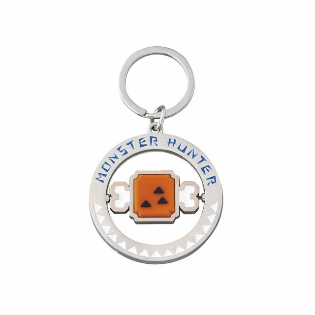 キーチェーン／裏表にデザインされた生肉とこんがり肉がクルクル回る