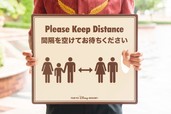 ソーシャルディスタンスの確保を呼びかけるサイン
