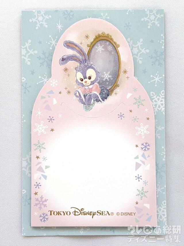 縦約10cm、横約6cmの淡いピンクのメモ。「ダッフィー＆フレンズのダンシング・スノーフレークス」付箋